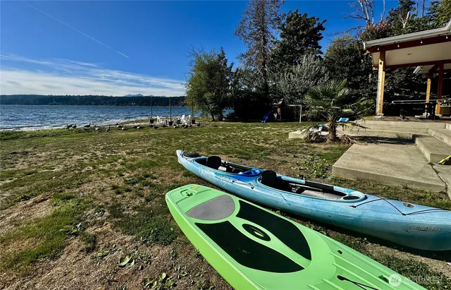 a view of a backyard with sitting area