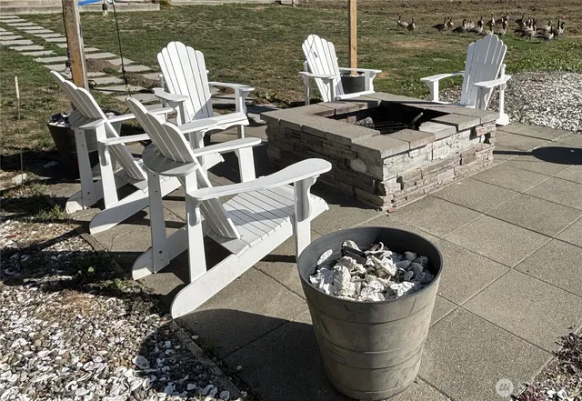 a view of a kitchen with a fireplace dining table and chairs