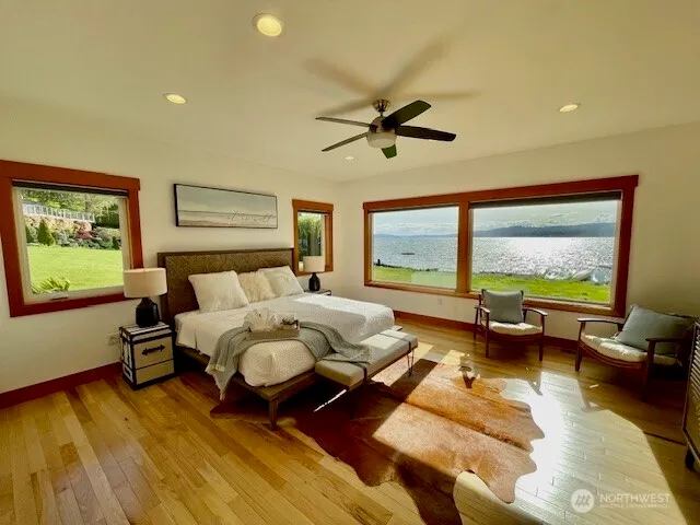 a bed room with furniture and a large window