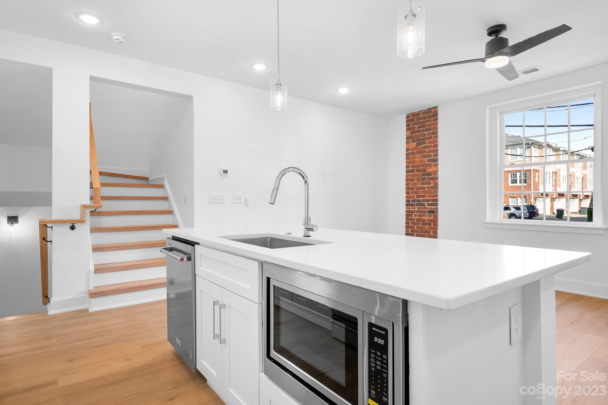201 Grandin Road, Unit 14 Charlotte, NC 28208 - Photo 3 of 15 a kitchen with a sink and a stove top oven
