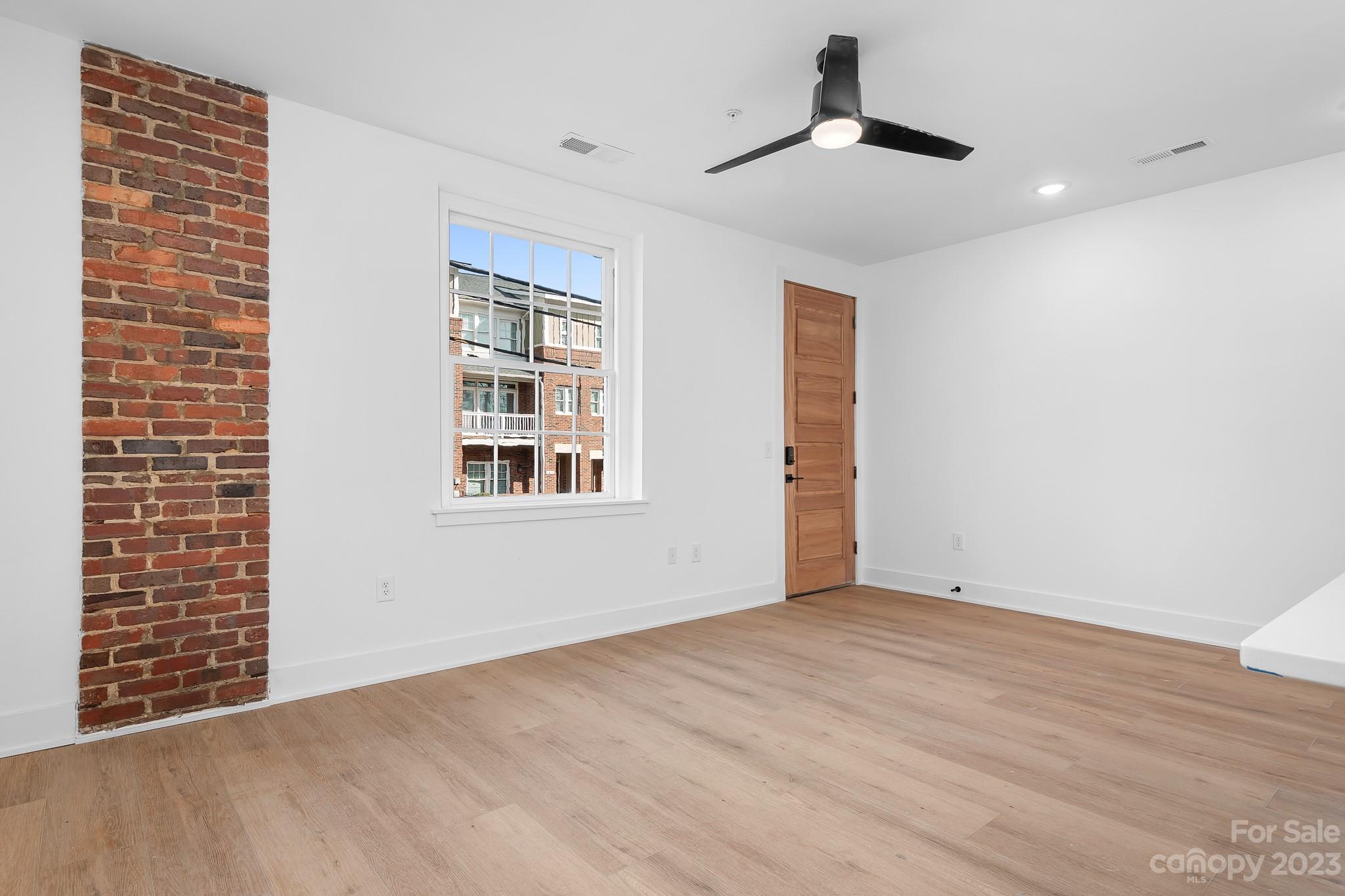 201 Grandin Road, Unit 14 Charlotte, NC 28208 - Photo 7 of 15 a view of an empty room with a window