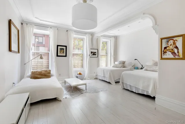 a spacious bedroom with a bed and a couch