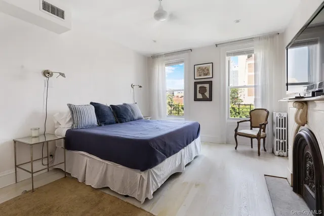 a bedroom with a bed and a cabinets