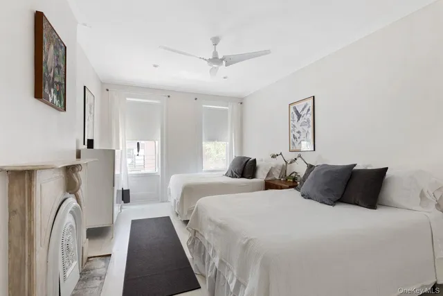 a bedroom with a large bed and a couch