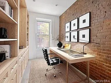 a view of a hallway with seating area