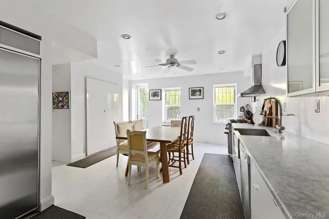 a dining room with furniture and window