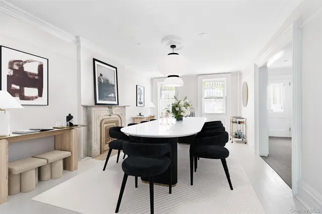 a bathroom with a sink a toilet and a window