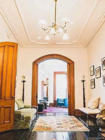 a bedroom with bed and wooden floor