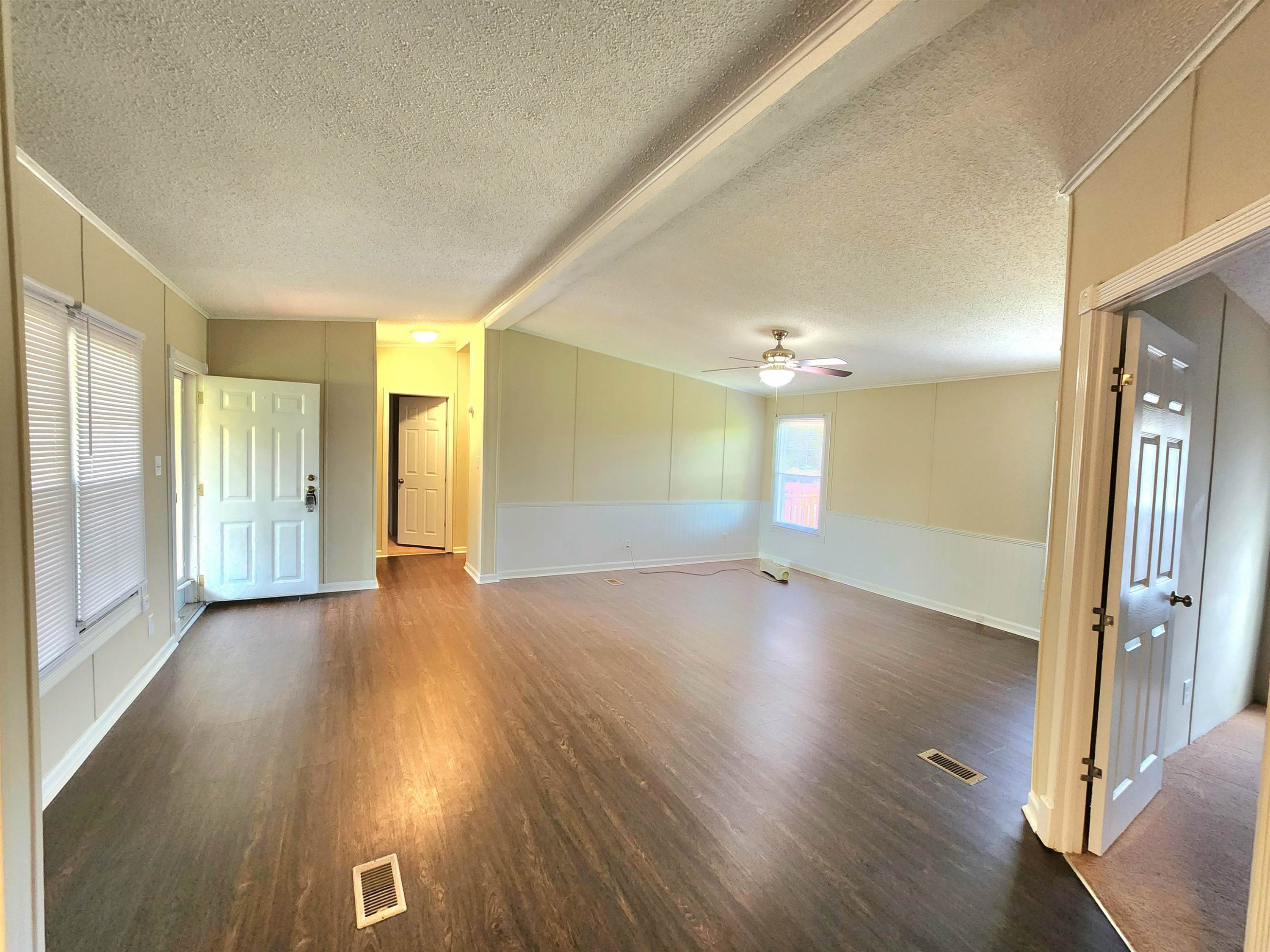 8333 Creek Road Willow Spring, NC 27592 - Photo 11 of 58 a view of a livingroom with wooden floor