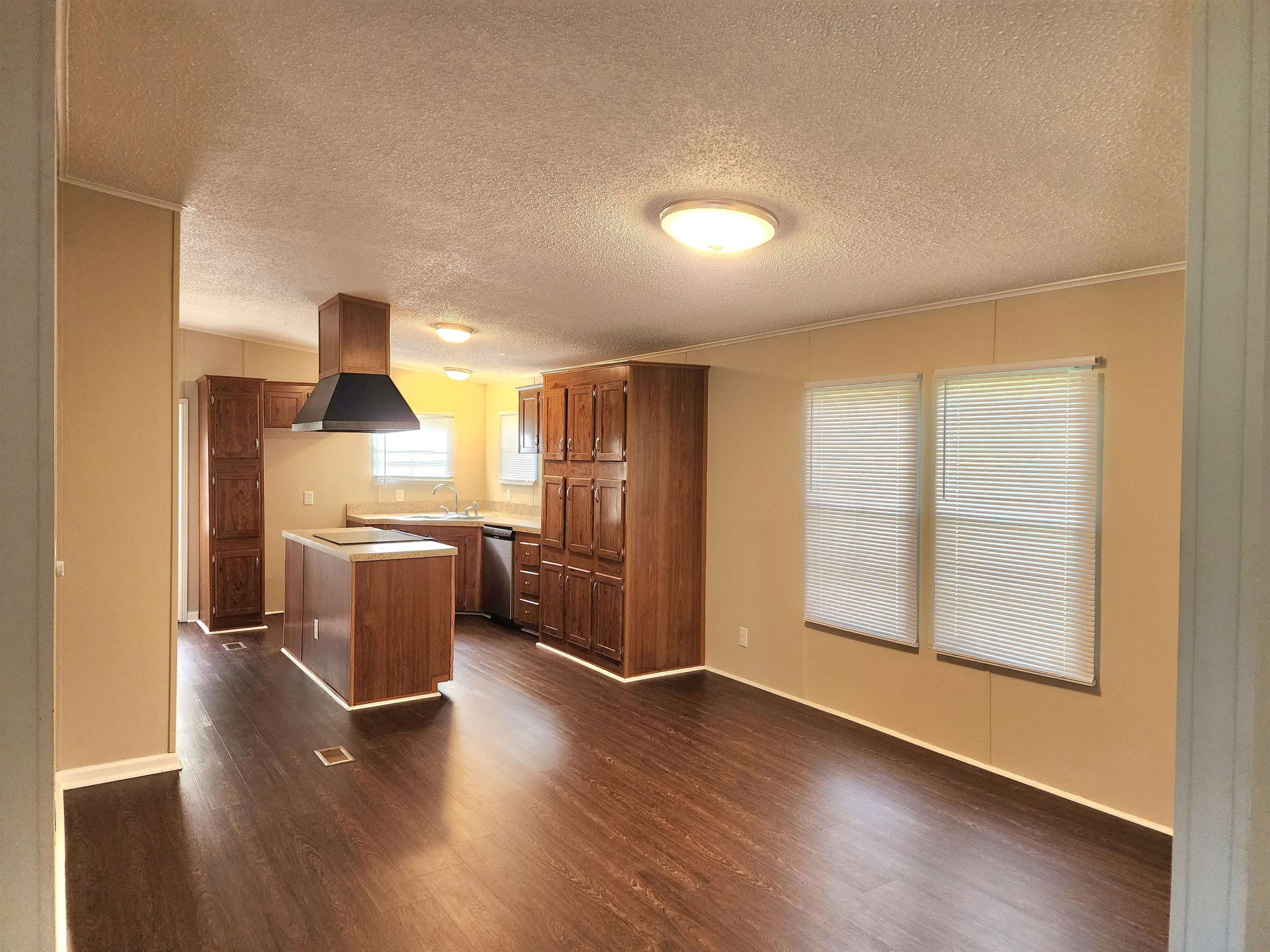 8333 Creek Road Willow Spring, NC 27592 - Photo 13 of 58 a view of kitchen with furniture and wooden floor