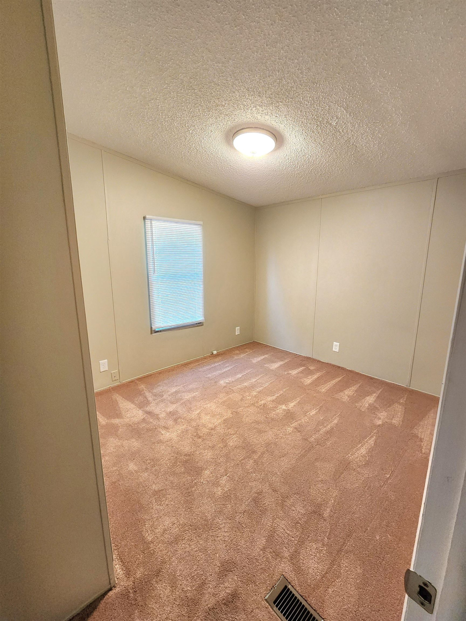 8333 Creek Road Willow Spring, NC 27592 - Photo 28 of 58 an empty room with a window