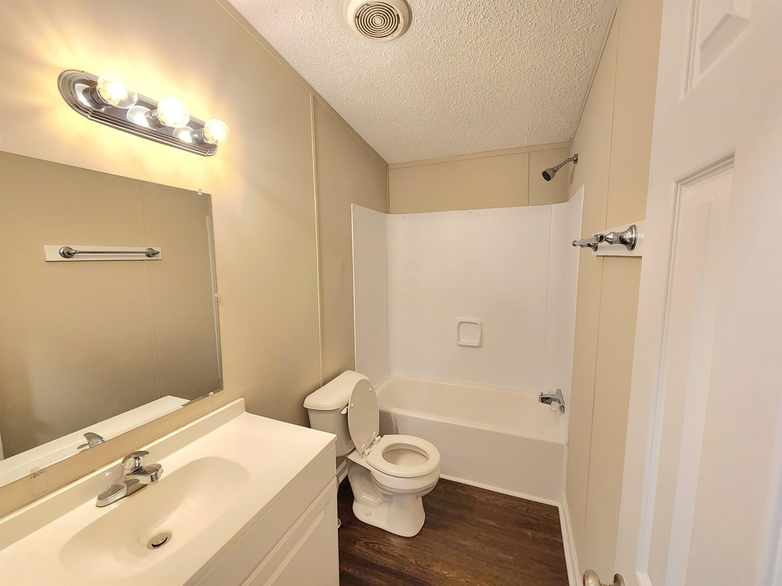 8333 Creek Road Willow Spring, NC 27592 - Photo 33 of 58 a bathroom with a sink a toilet and shower