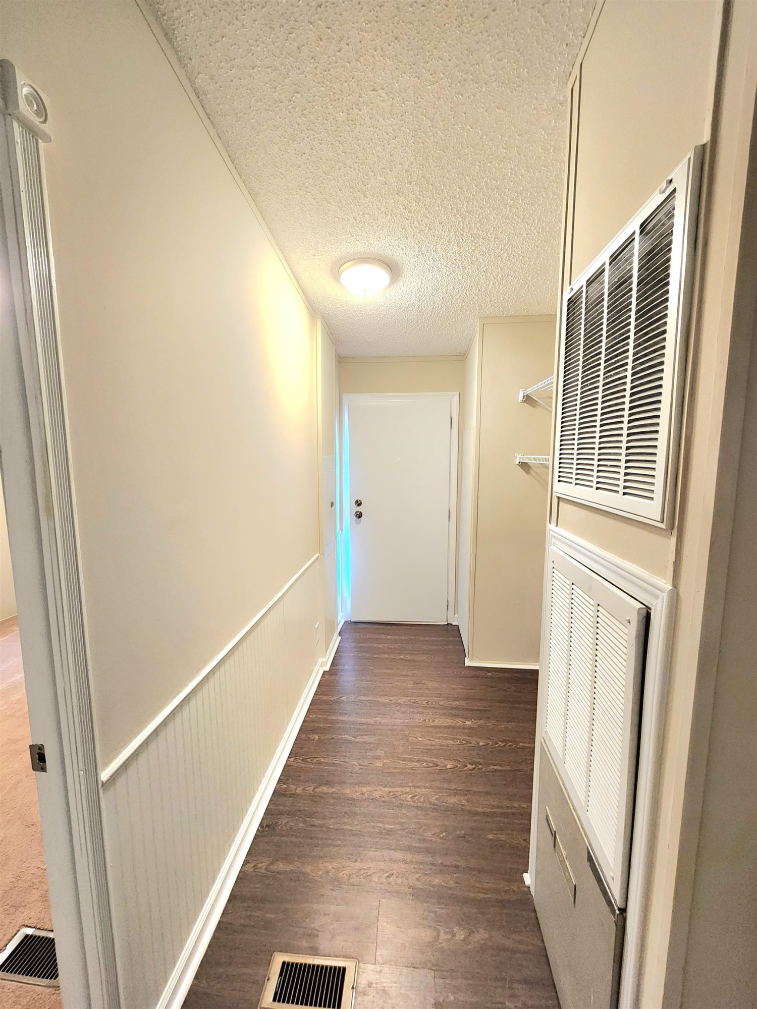 8333 Creek Road Willow Spring, NC 27592 - Photo 36 of 58 a view of hallway with stairs and wooden floor