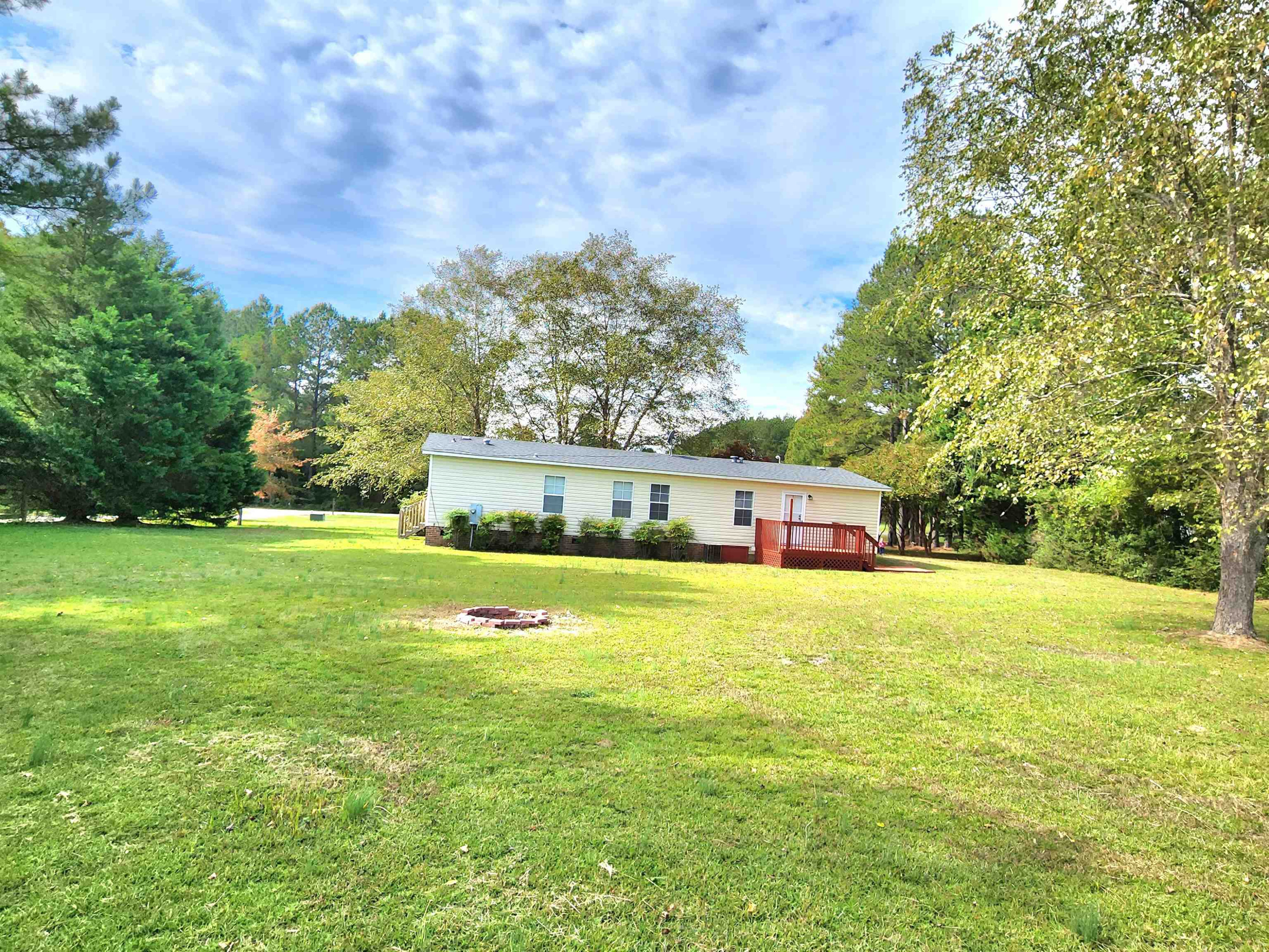 8333 Creek Road Willow Spring, NC 27592 - Photo 50 of 58 a front view of house with yard and trees