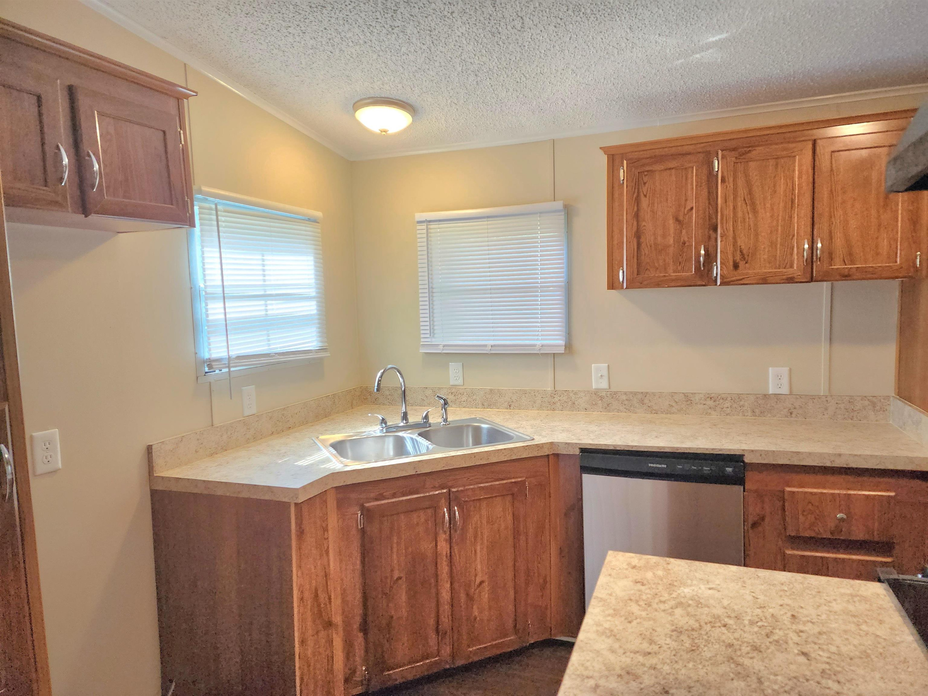 8333 Creek Road Willow Spring, NC 27592 - Photo 6 of 58 a bathroom with a sink and a mirror