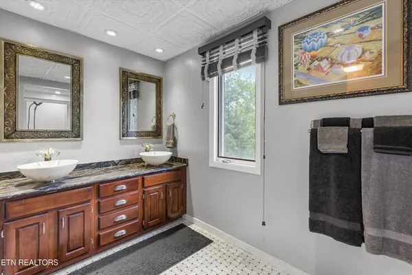 a bathroom with a sink and mirror