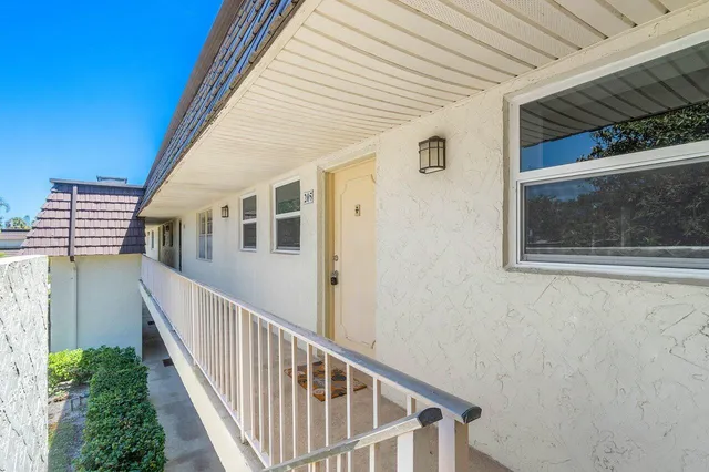a view of a house with wooden floor and windows
