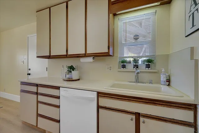 a kitchen with a sink and a window
