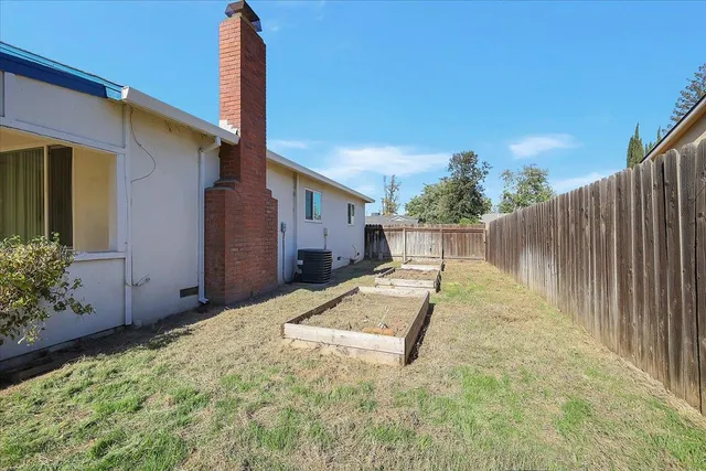 a view of backyard with small pool