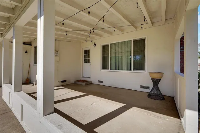 a view of a hallway with bathroom
