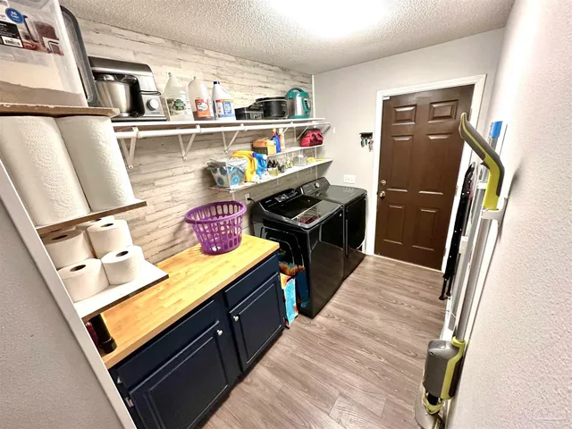 a living room with furniture fireplace and a flat screen tv