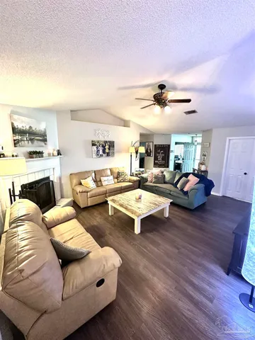 a bedroom with a bed and flat screen tv