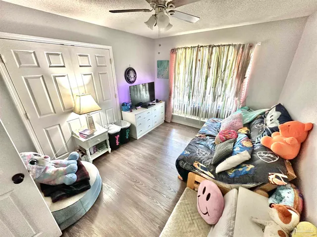 a bedroom with furniture and a chandelier