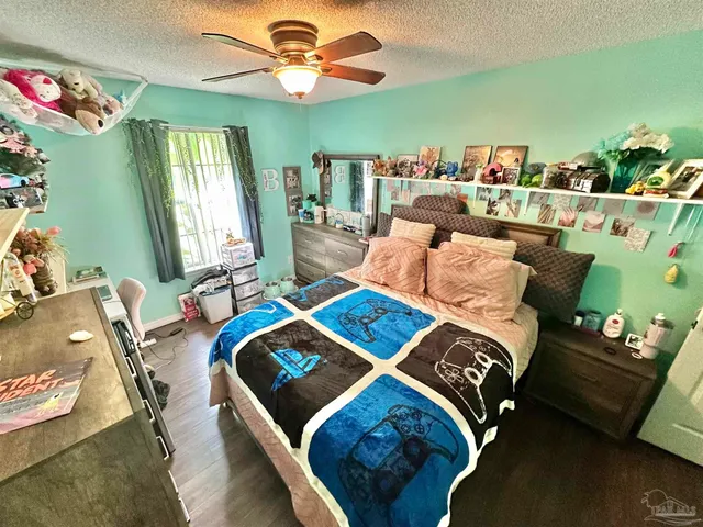 a bathroom with a sink a toilet and shower curtain