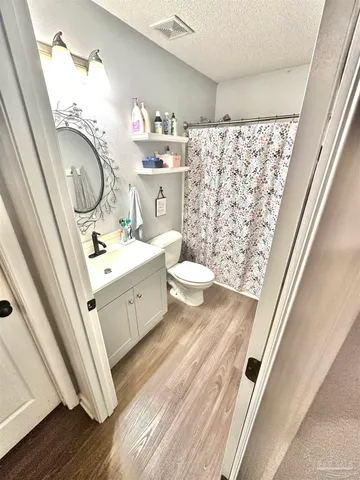 a view of a refrigerator in a kitchen