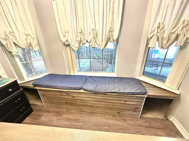 a living room with a stove and a microwave