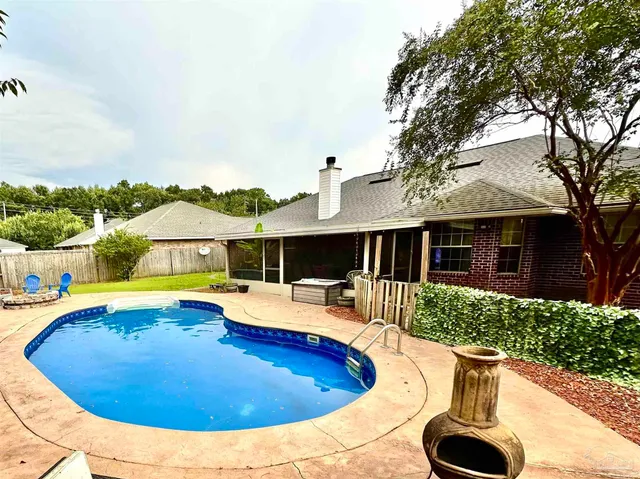 a view of a swimming pool with a patio