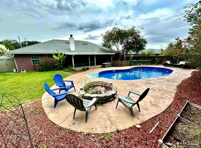 a view of a swimming pool with lounge chair