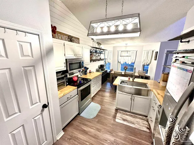 a living room with furniture fireplace and a flat screen tv
