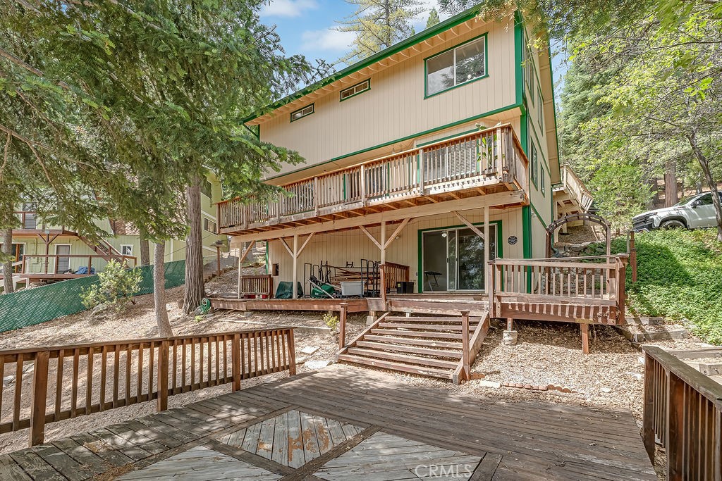 318 Old Toll Road Lake Arrowhead, CA 92352 - Photo 36 of 44 a front view of a house with a bench