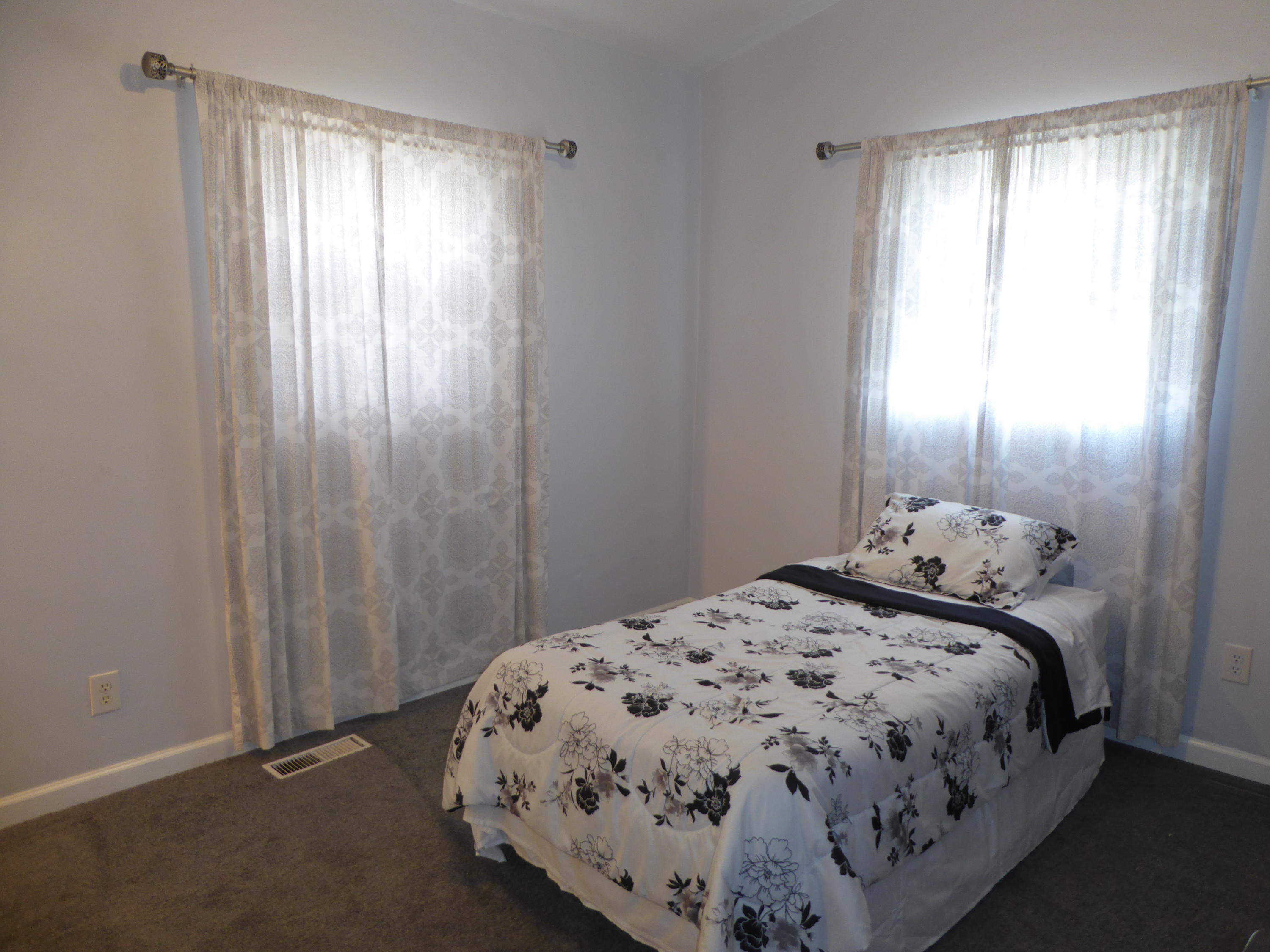 810 Scuffling Hill Road Rocky Mount, VA 24151 - Photo 15 of 52 a bedroom with a bed and a window