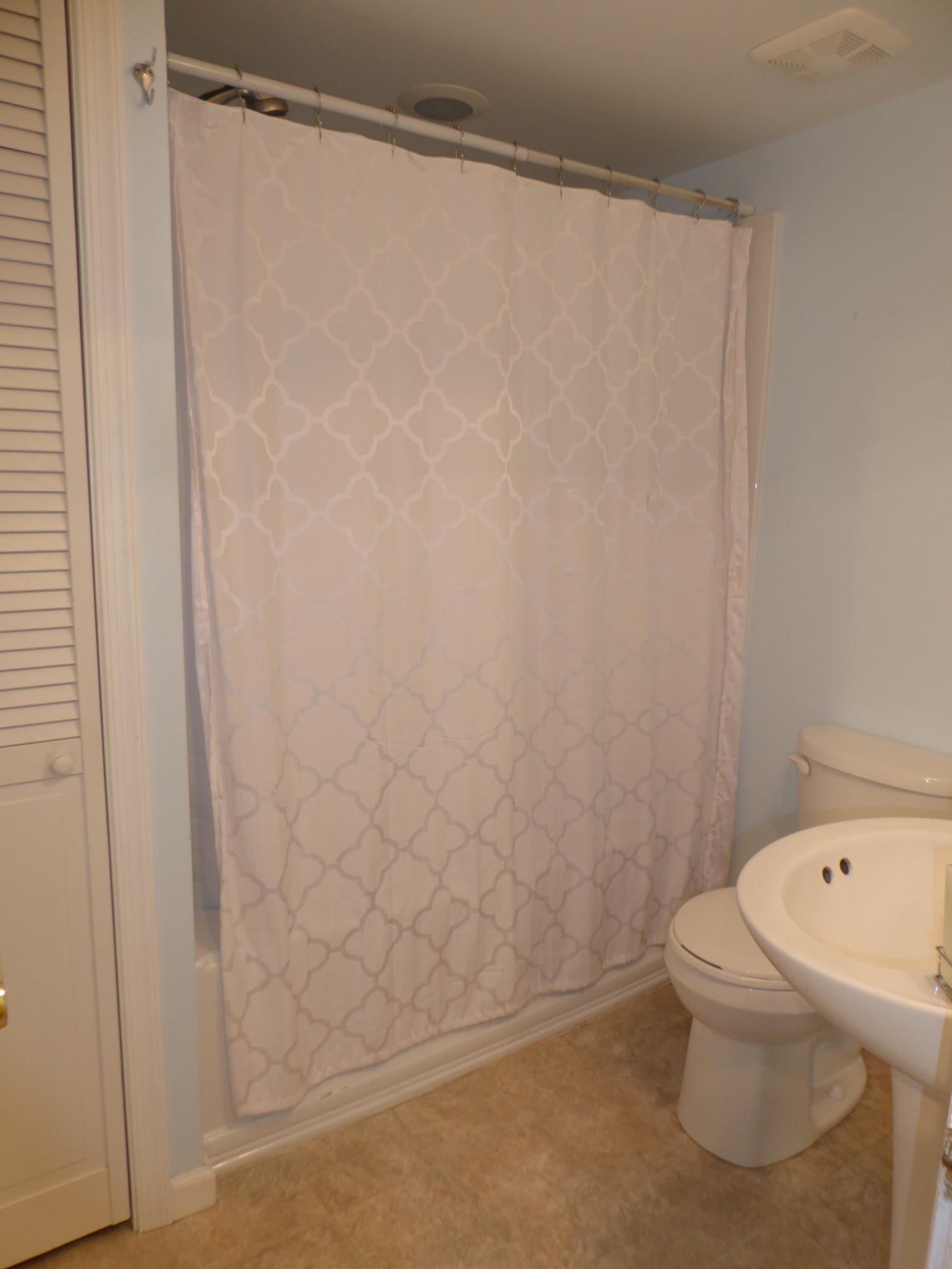 810 Scuffling Hill Road Rocky Mount, VA 24151 - Photo 17 of 52 a bathroom with a white toilet and a shower