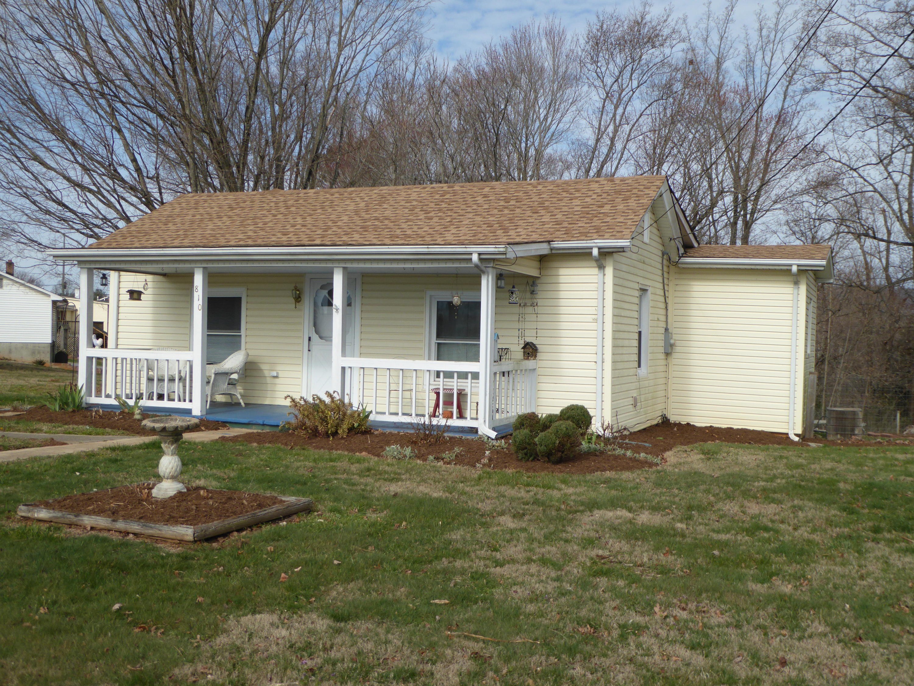 810 Scuffling Hill Road Rocky Mount, VA 24151 - Photo 23 of 52 a backyard of a house with yard and garage