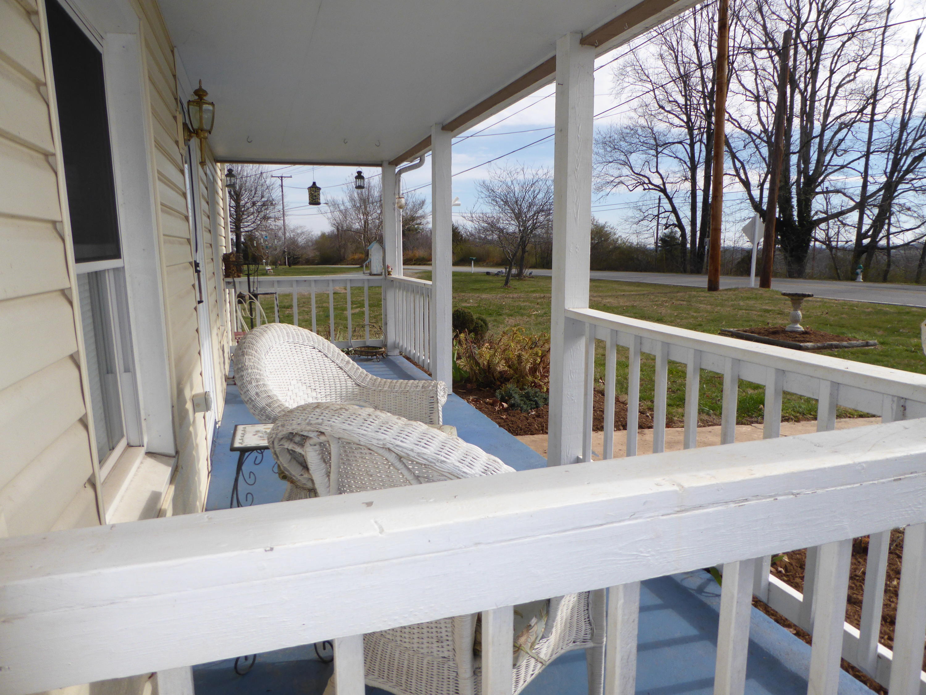 810 Scuffling Hill Road Rocky Mount, VA 24151 - Photo 29 of 52 a view of a room with a large window and wooden floor