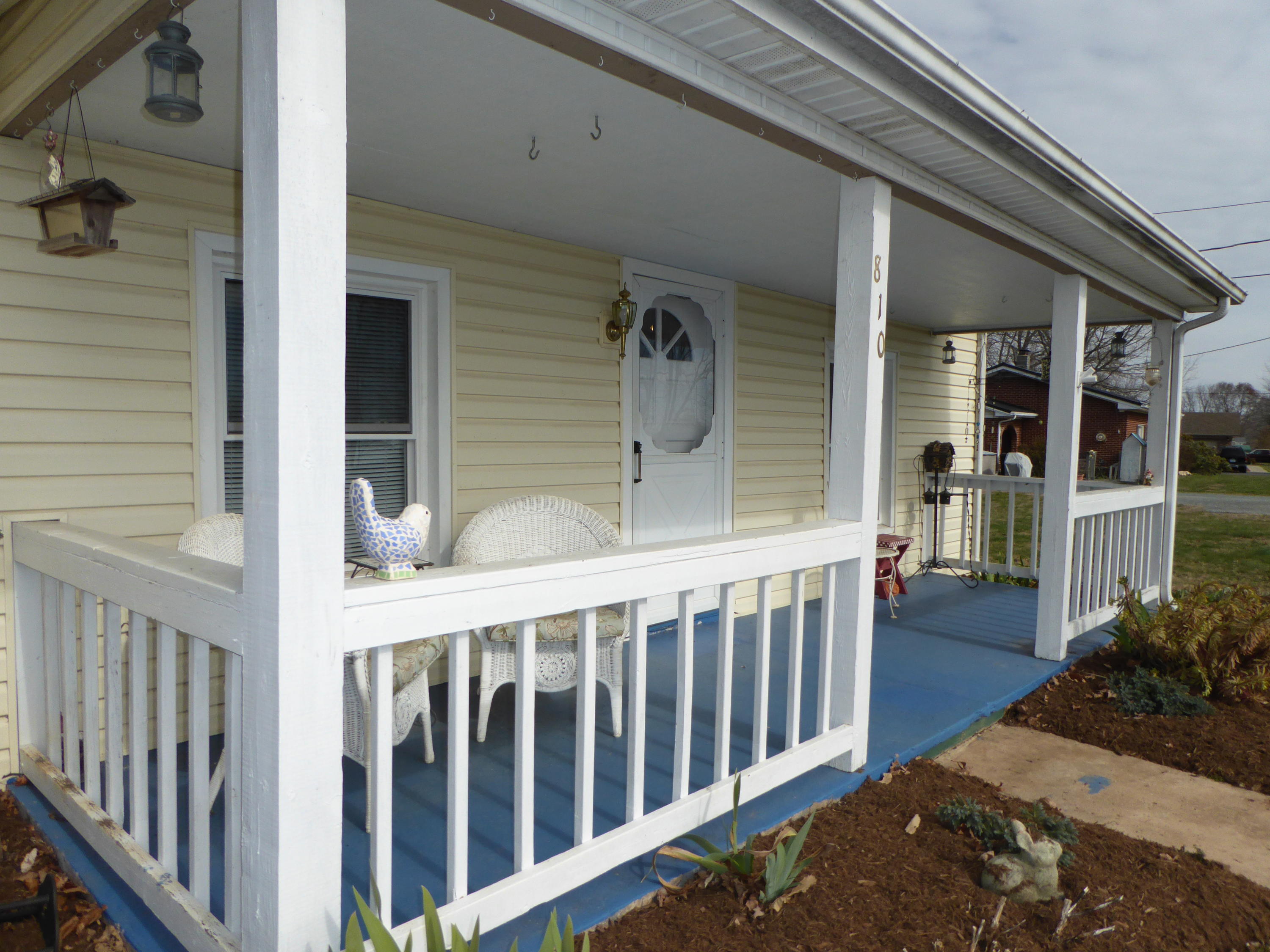 810 Scuffling Hill Road Rocky Mount, VA 24151 - Photo 4 of 52 a view of a porch with a table and chairs