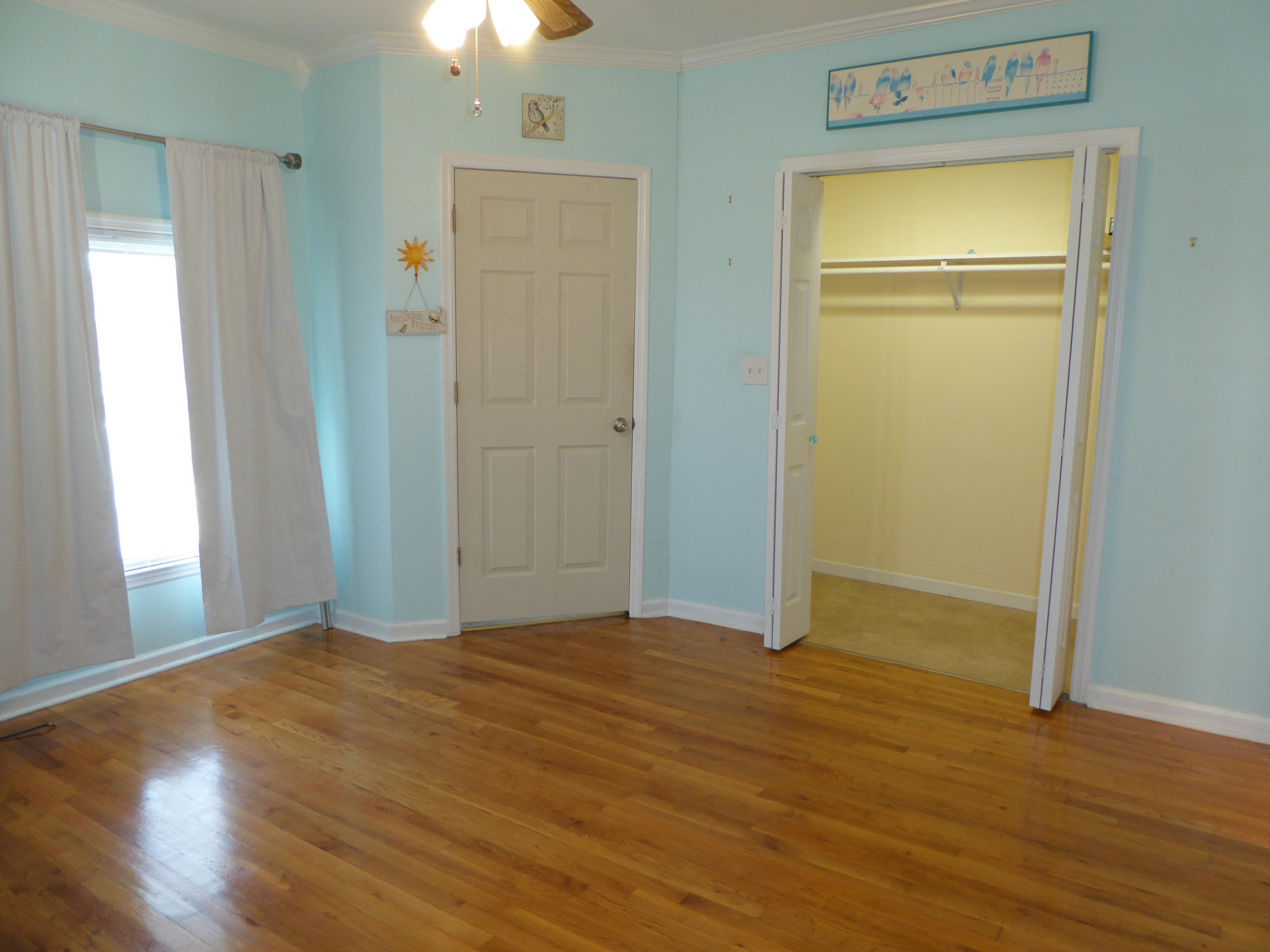 810 Scuffling Hill Road Rocky Mount, VA 24151 - Photo 40 of 52 a view of an empty room with wooden floor and a window