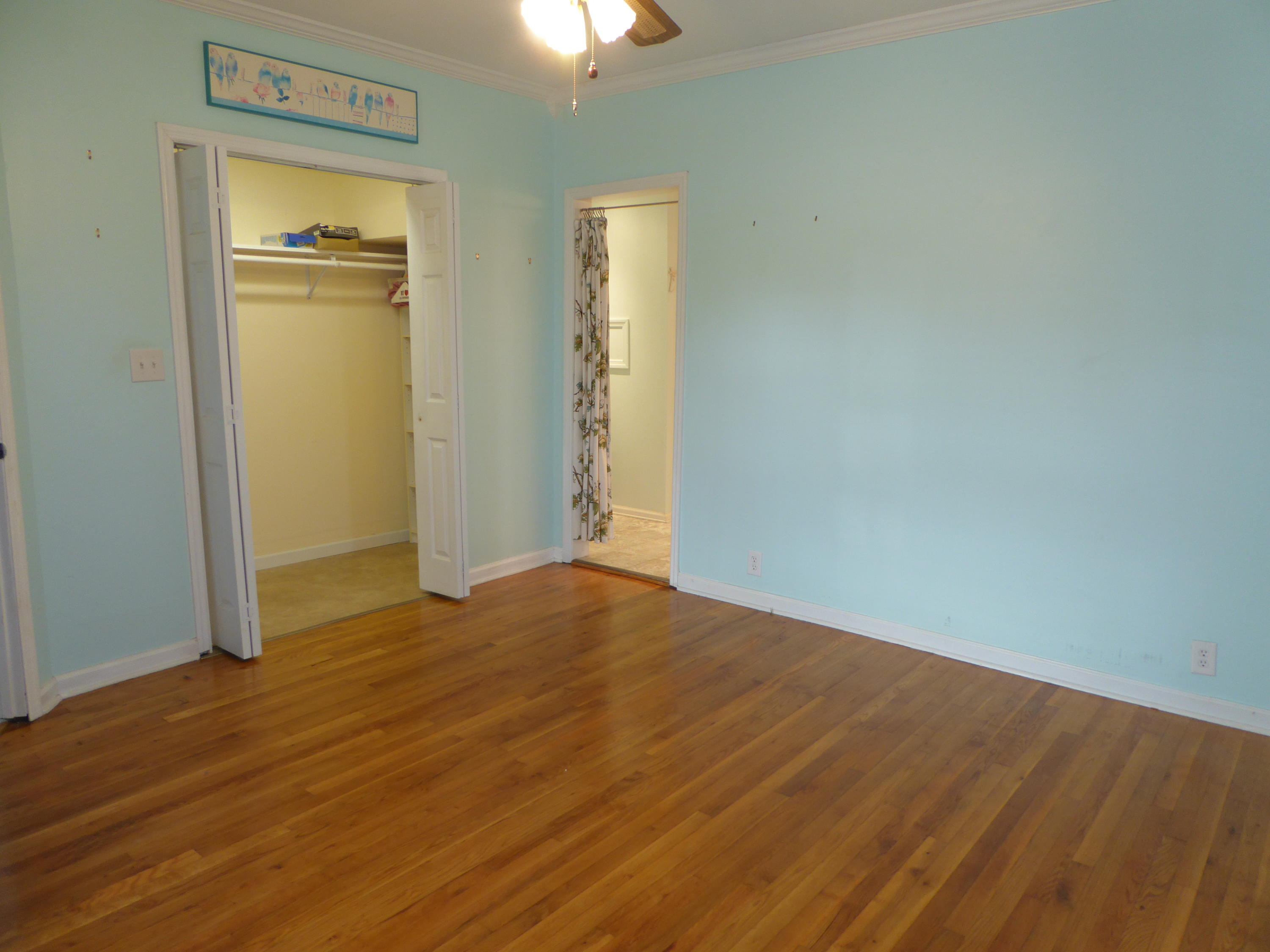 810 Scuffling Hill Road Rocky Mount, VA 24151 - Photo 41 of 52 an empty room with wooden floor and windows