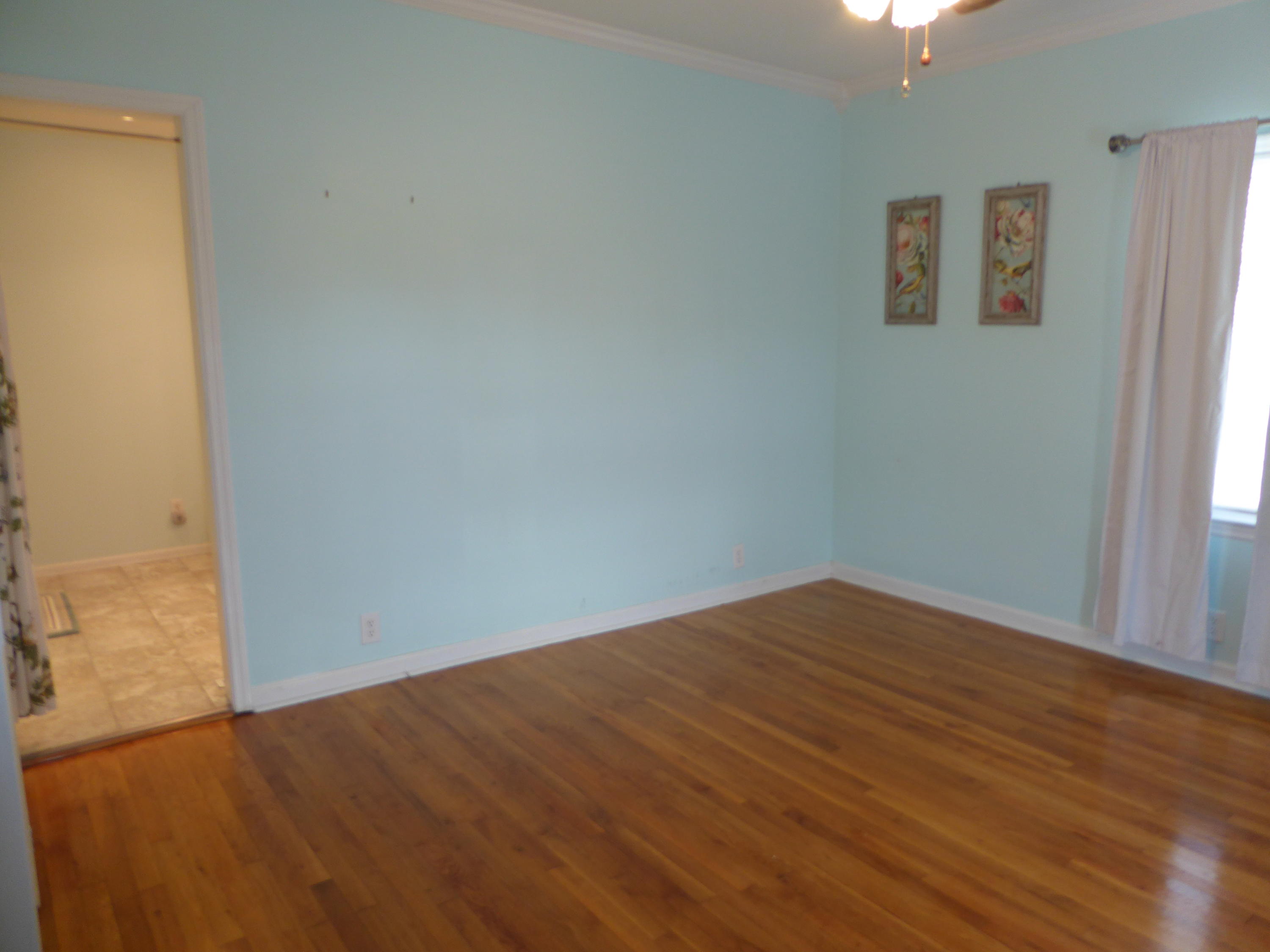 810 Scuffling Hill Road Rocky Mount, VA 24151 - Photo 42 of 52 an empty room with wooden floor and windows