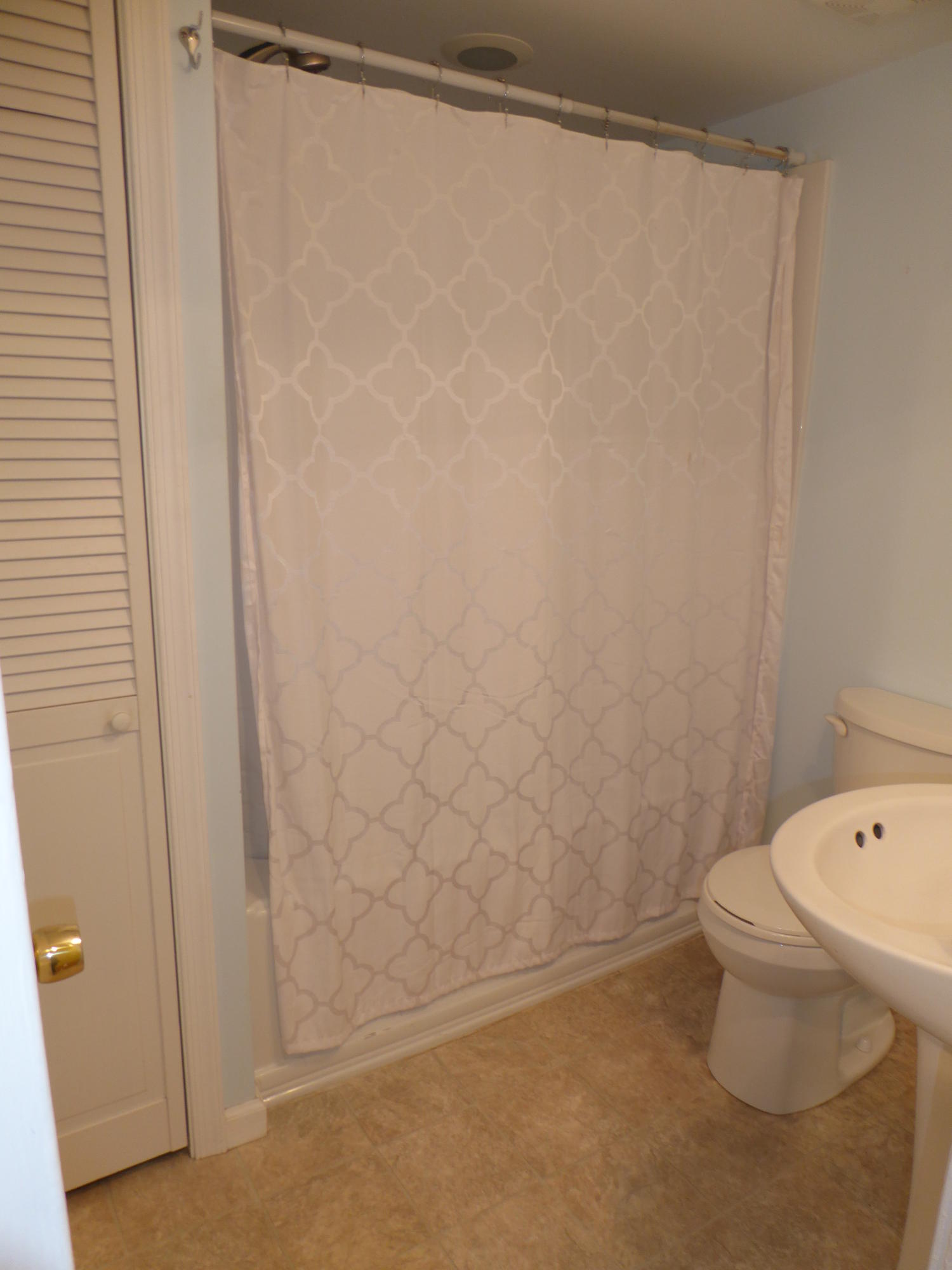 810 Scuffling Hill Road Rocky Mount, VA 24151 - Photo 48 of 52 a white toilet sitting next to a shower