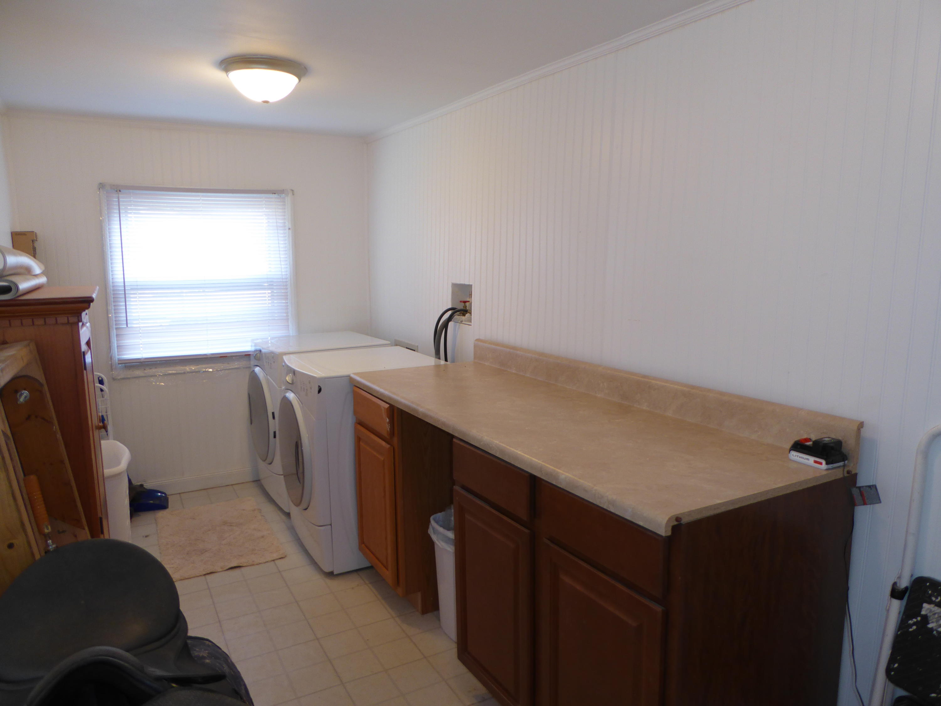 810 Scuffling Hill Road Rocky Mount, VA 24151 - Photo 50 of 52 a kitchen with a sink cabinets and a window