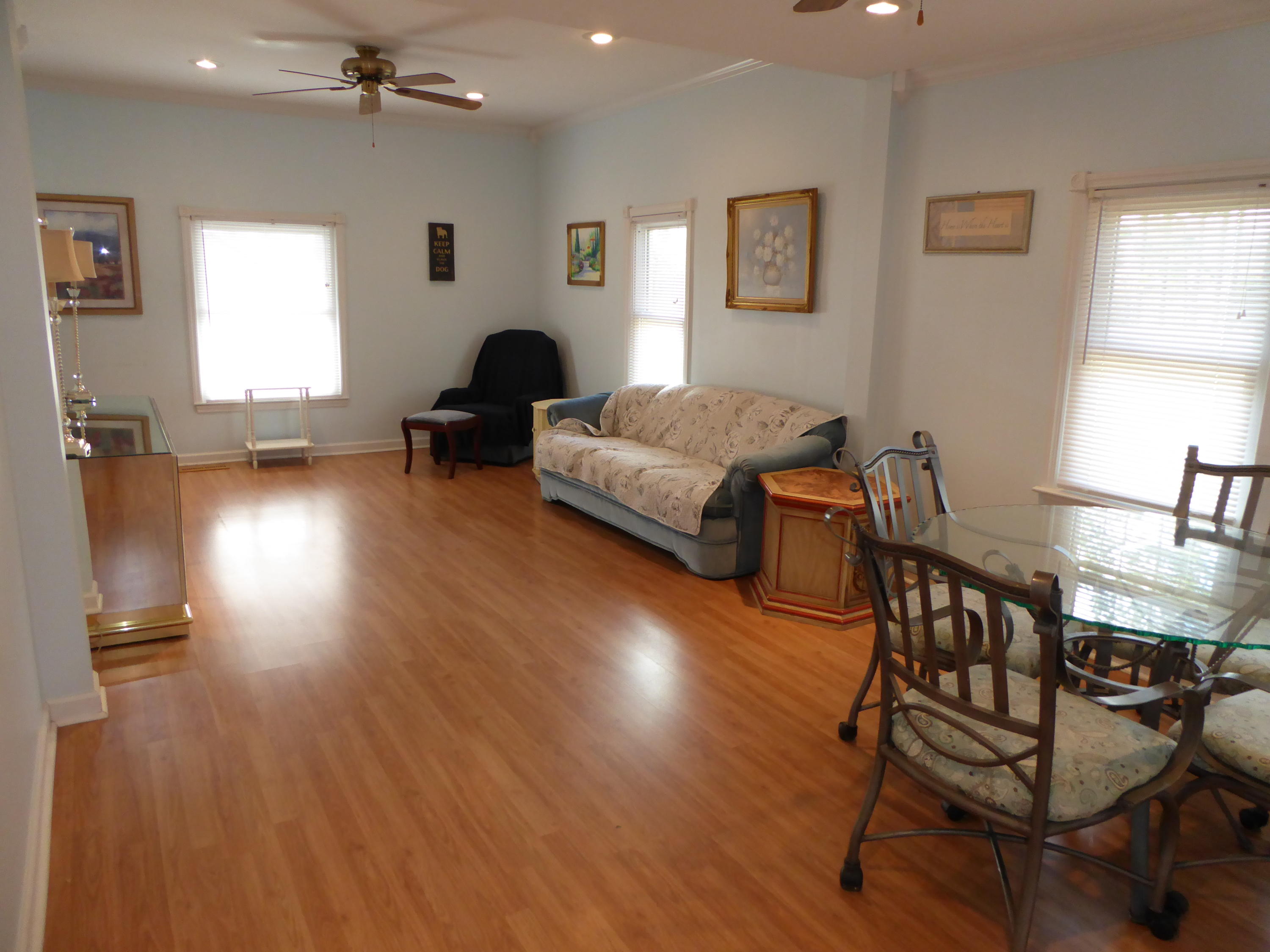 810 Scuffling Hill Road Rocky Mount, VA 24151 - Photo 7 of 52 a living room with furniture and a wooden floor