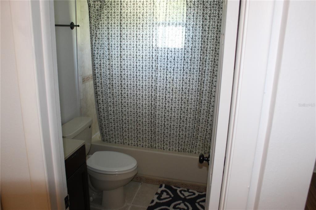 403 Murphy Road Winter Springs, FL 32708 - Photo 13 of 23 a bathroom with a toilet and a shower