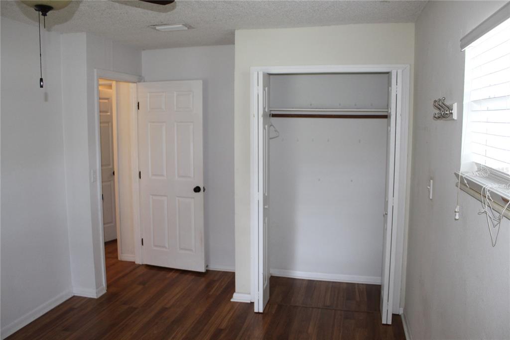 403 Murphy Road Winter Springs, FL 32708 - Photo 15 of 23 a view of an empty room with wooden floor and a window