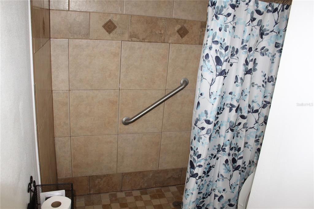 403 Murphy Road Winter Springs, FL 32708 - Photo 17 of 23 a bathroom with a shower and a shower curtain