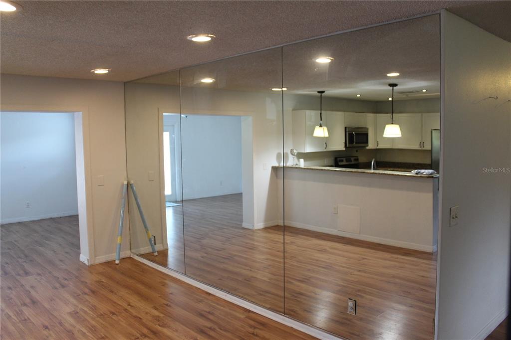 403 Murphy Road Winter Springs, FL 32708 - Photo 8 of 23 a view of a kitchen with a sink and wooden floor