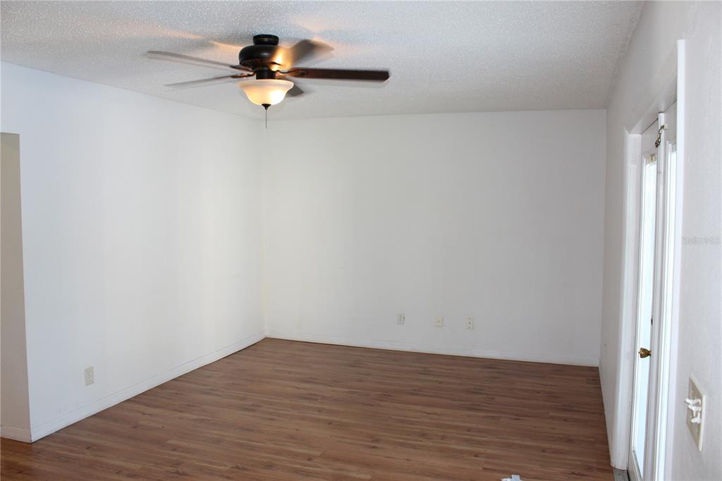 403 Murphy Road Winter Springs, FL 32708 - Photo 9 of 23 a view of empty room with wooden floor